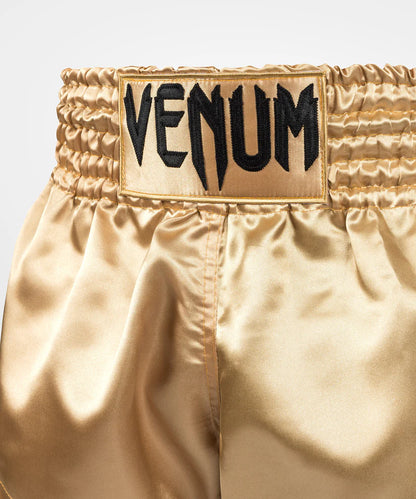 Pantalon corto de muay thai Venum Classic, dorados y negros