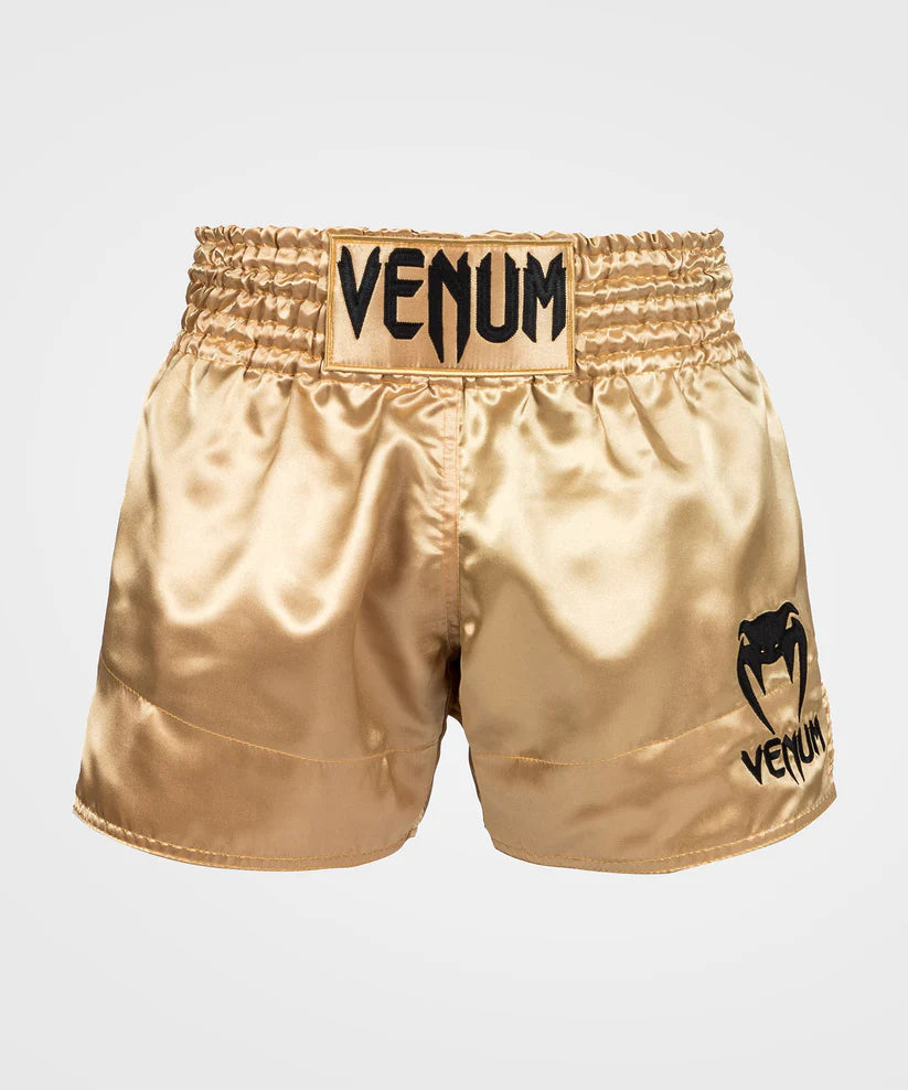 Pantalon corto de muay thai Venum Classic, dorados y negros